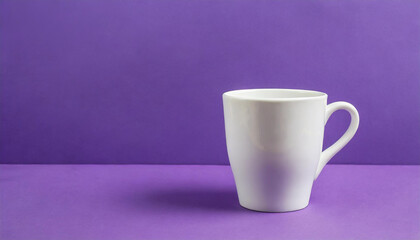 Obraz premium Close-up of ceramic white cup on isolated purple background. Tea or coffee mug. Drink ware. Mock up.