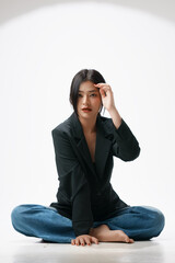 Gorgeous Young Asian female close up face with perfect make-up and red lips. Beautiful woman in black suits  look confidence and charming.