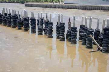 rubber wheel wall protect wave in mangrove forest at Thailand