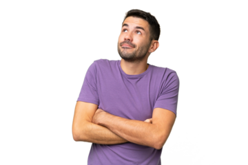 Young handsome caucasian man over isolated background making doubts gesture while lifting the shoulders