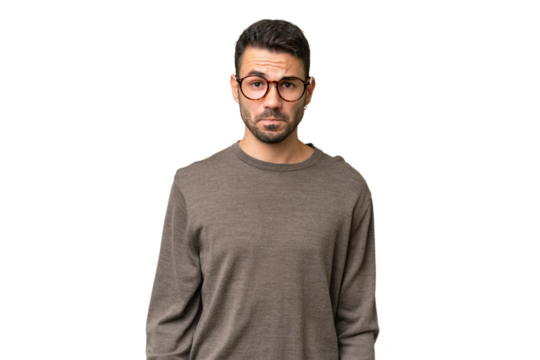 Young handsome caucasian man over isolated background with sad expression