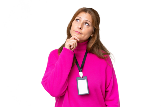 Middle-aged caucasian woman with ID card over isolated background and looking up