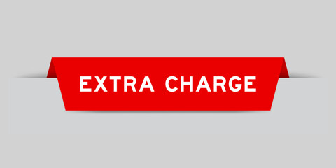 Red color inserted label with word extra charge on gray background
