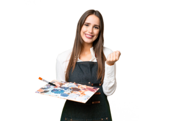 Young artist woman holding a palette over isolated chroma key background making money gesture