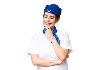 Airplane stewardess over isolated chroma key background looking to the side