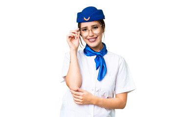 Airplane stewardess over isolated chroma key background with glasses and happy