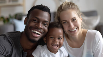 Close up of a happy multiethnic family with a child laughing together at home - obrazy, fototapety, plakaty