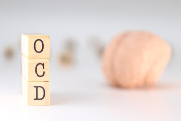 OCD acronym. Concept of Obsessive compulsive disorder isolated with brain on white background.