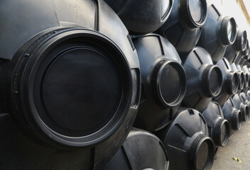 black and white water tanks, plastic PVC ,organized next to each other - obrazy, fototapety, plakaty
