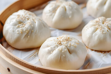 Fototapeta na wymiar Delicious bao buns (baozi) on light table, closeup