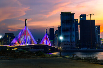 Night city and bridge with sun set