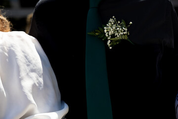 Flower on suit jacket of groom from a recent wedding