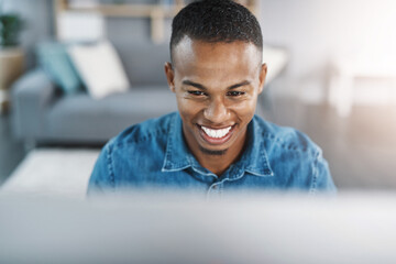 Happy, confident and black man by computer in office, workspace and desk professional in creative...