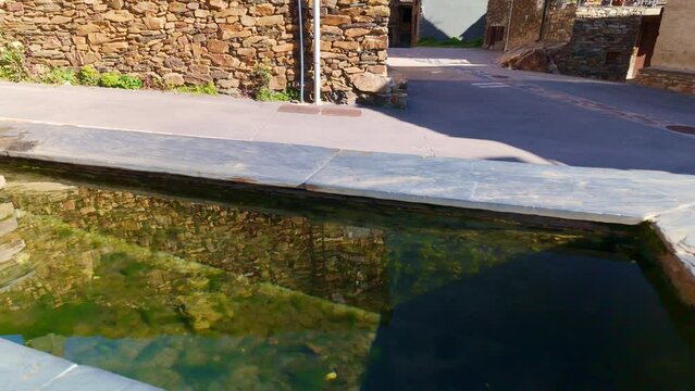Crystal clear water springs coming down from the mountain in the black villages, Guadalajara.