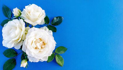 Beautiful bouquet with white and pink roses and petals, top view on blue backdrop. Vintage background with flower bouquet and empty space for text. Generative AI.