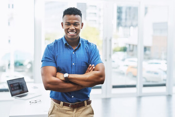 Smile, portrait and African businessman with arms crossed in office for confidence, positive...