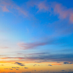 Blue sky with clouds and bright sunrise.