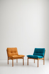 Orange and Blue Chairs Against a White Background, Perfect for Modern Interior and Decor