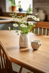 b'A beautiful bouquet of chamomile flowers in a ceramic vase on a wooden table'