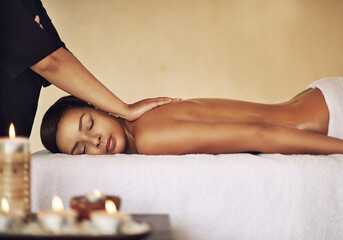 Back massage, relax and wellness with woman in spa for health, skincare or stress relief on bed....