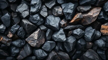 b'Dark, rough stones of various sizes with sharp edges'