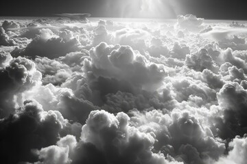 b'black and white photo of clouds from airplane window'
