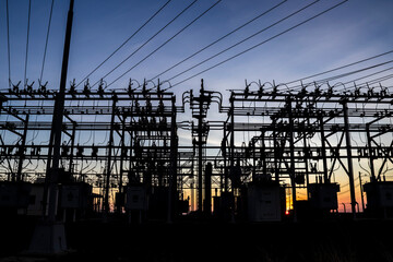 Silhouette of substation for the distribution of electric power with  in Brazil, with sundown...