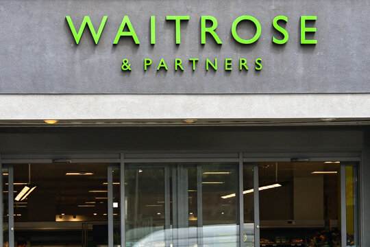 London, England, UK - 27 June 2023: Entrance to a branch of Waitrose supermarket in central London