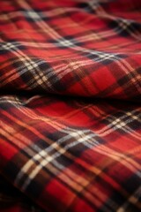 b'Red and black wool fabric with a tartan pattern'