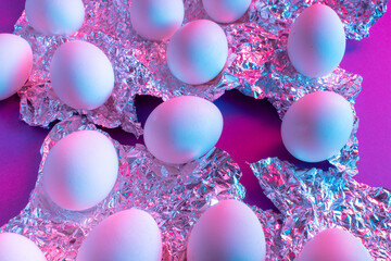 White Easter egg with colorful ultraviolet holographic neon lights. Creative concept.