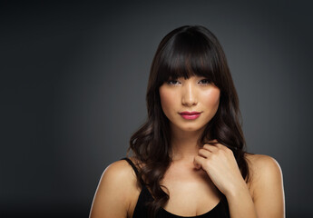 Portrait, asian woman and beauty in studio background for glamor with stylish, haircare and mockup...