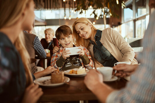 Family enjoying time together at a cafe - Powered by Adobe