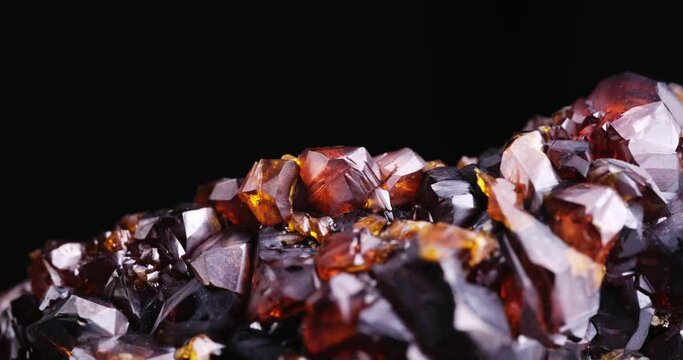 gemmy sphalerite footage on black background. macro detail close-up rough raw unpolished semi-precious gemstone. 