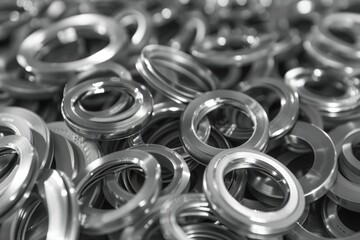 A pile of metal rings stacked on top of each other. Great for industrial or manufacturing concepts
