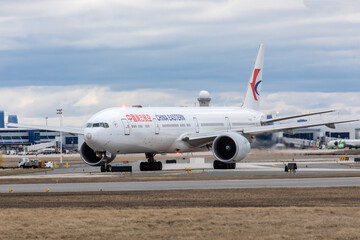 Fototapeta premium Mississauga Canada, April 9, 2022; A China Southern Boeing 777 on the runway at Toronto Pearson Airport YYZ waiting for clearance for takeoff