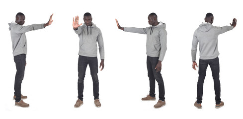 various poses of a  group of same man showing stop sign with his hand on white background