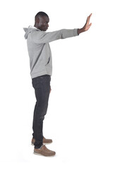 side view of a man showing stop sign with his hand on white background