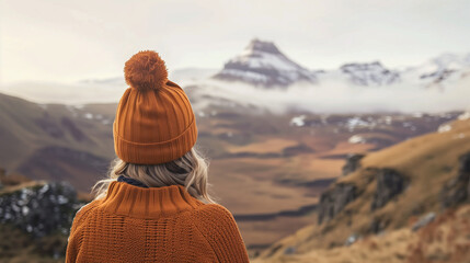 woman with orange hat in highlands - obrazy, fototapety, plakaty