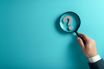 magnifying glass in hand on blue background with copy space