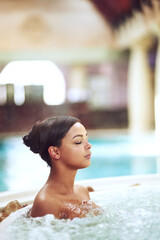Woman, hot tub and relax calm at spa hotel for stress relief treatment or hydrotherapy, resort or...