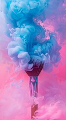 Dramatic and colorful image of a makeup brush with exploding pink and blue ink clouds creating a dynamic and stylish visual