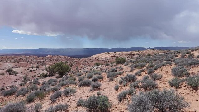Panning the Escalante desert landscape as storm goes by in Utah.