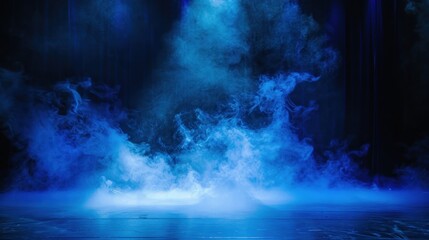 Black stage with blue smoke below, like fog on the floor. In a dark room.	
