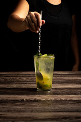 Refreshing mojito. Fresh lime citrus juice or soft drink with ice and mint leaves. Glass with...