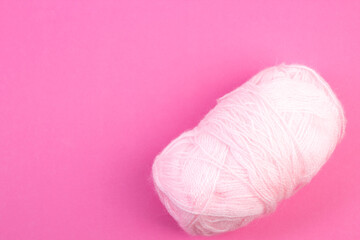 Knitting yarn for knitting on pink background. white. - 798134511