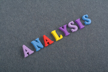 ANALYSIS word on black board background composed from colorful abc alphabet block wooden letters,...