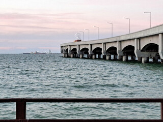 Fototapeta na wymiar Progreso is a Mexican port city on the Yucatan Peninsula with its iconic arched pier and famous boardwalk