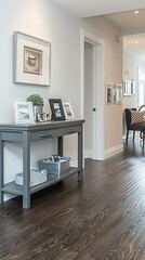 b'Home interior with hardwood floors and gray console table'
