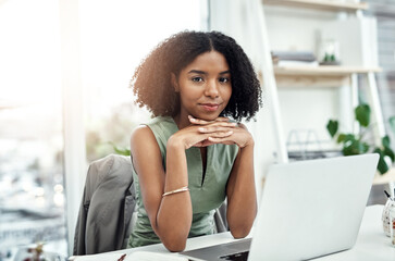 Black woman, portrait and laptop at desk as writer for blog project or article, creative or...
