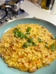 risotto with borlotti beans, creamy risotto, basil, finely chopped vegetables in risotto, homemade warm dish
